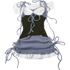 Black and blue dress with white accents on a white background