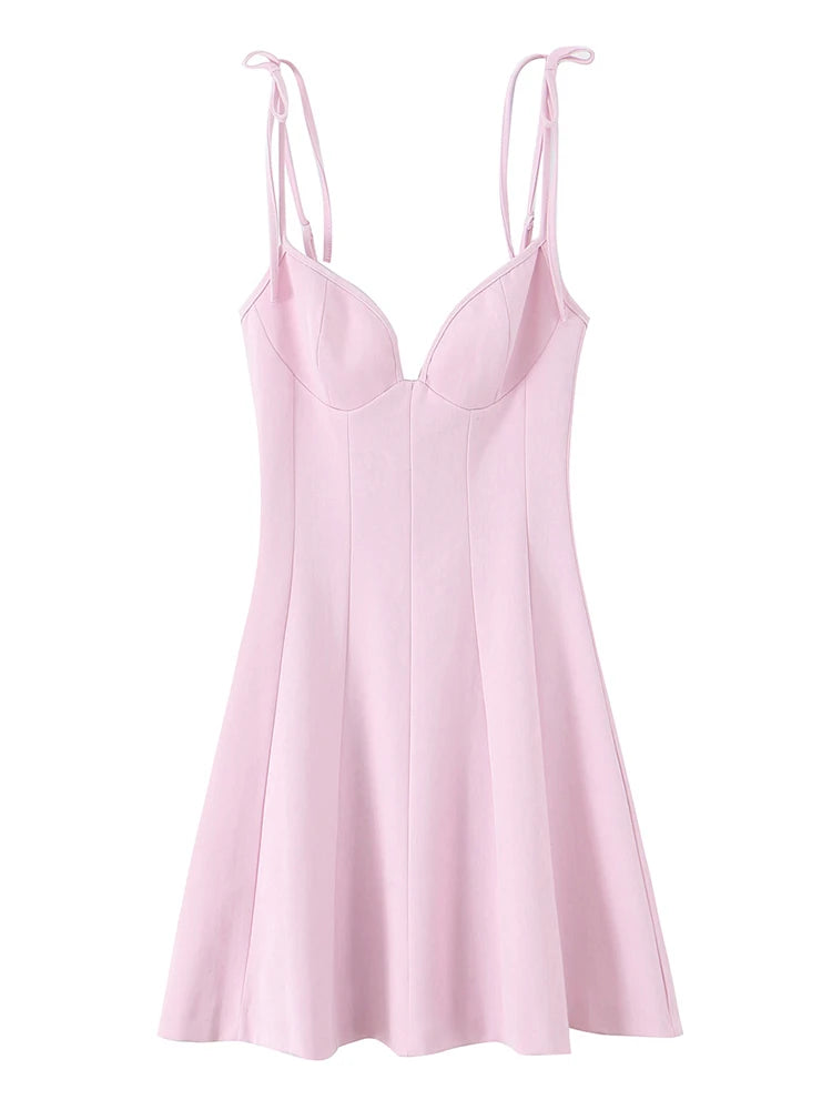 A light pink sleeveless slip dress with thin adjustable tie-shoulder straps, a sweetheart neckline, and a flared skirt, shown against a plain white background.