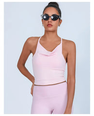 Woman wearing a pink athletic outfit with sunglasses- front view