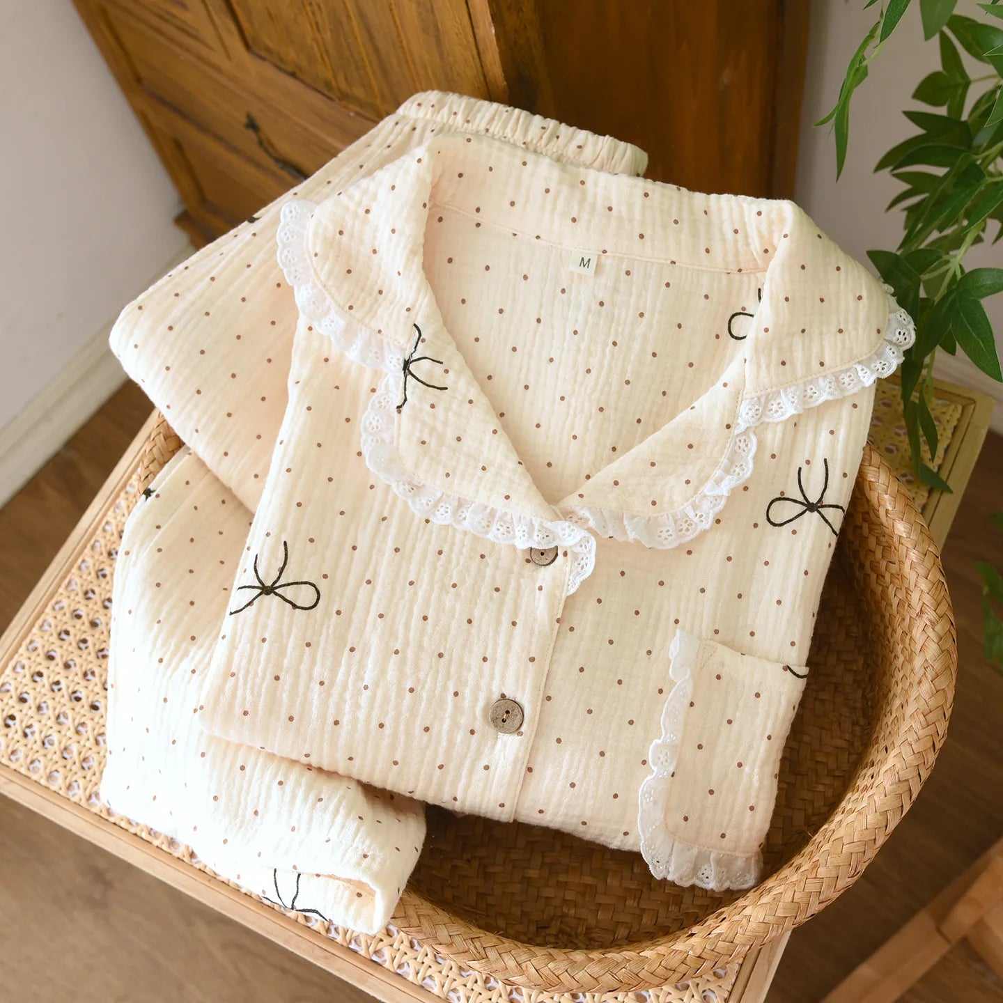 white polka dot shirt and pants on a woven basket