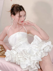 Women's mini dress with flare skirt, corset detailing, and strappy design.