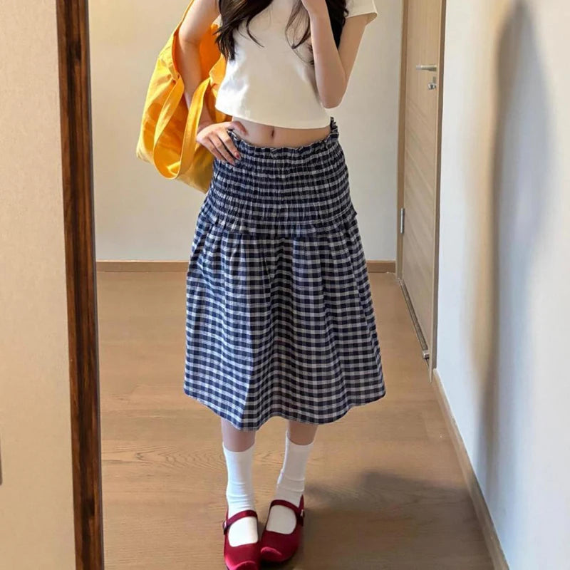 Women's blue elastic high waist plaid skirt with A-line silhouette.

