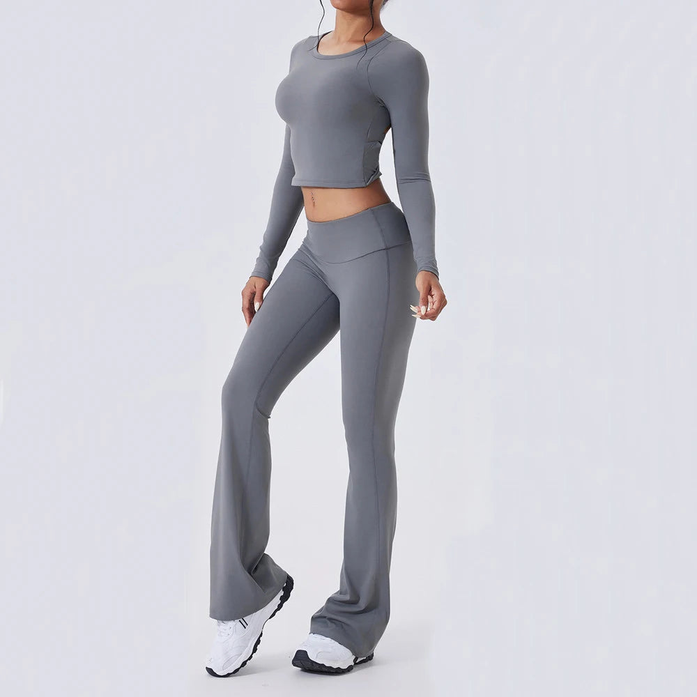 Person wearing a gray athletic outfit - side view