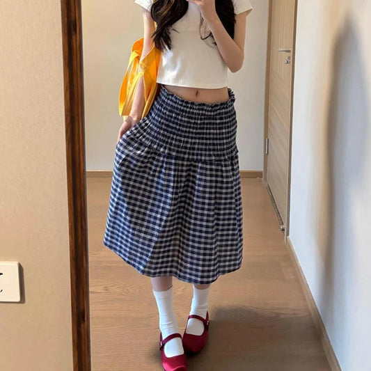 Women's blue elastic high waist plaid skirt with A-line silhouette.

