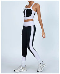 Person wearing a black and white athletic outfit- side view