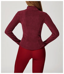 Maroon jacket and red pants on a plain background