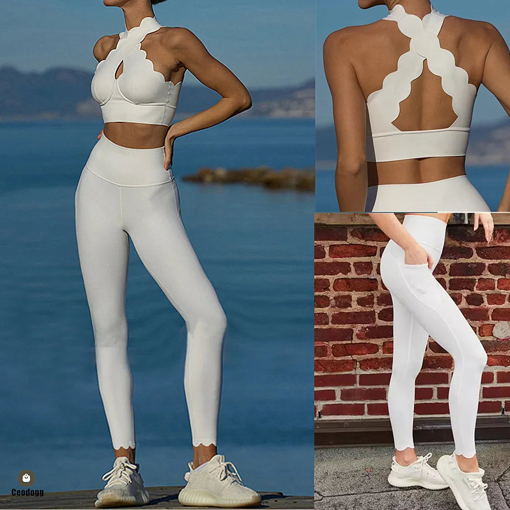 Woman wearing a white sports bra and leggings set with a scenic background.