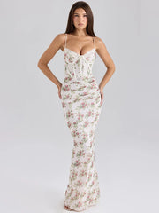 Woman wearing a floral dress on a gray background