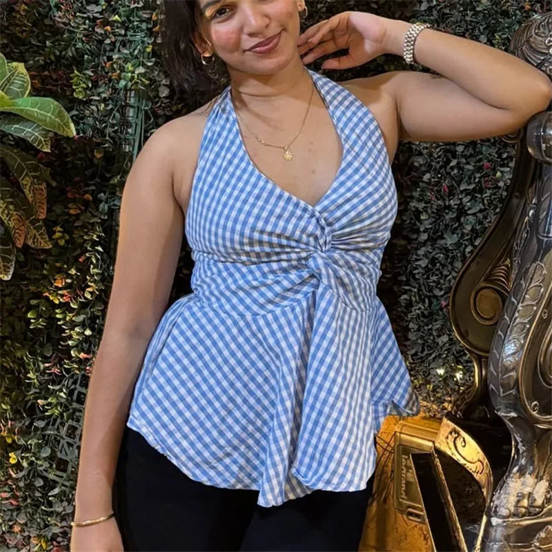Blue and white gingham halter top with a deep V-neck, knotted twist front, and peplum hemline.