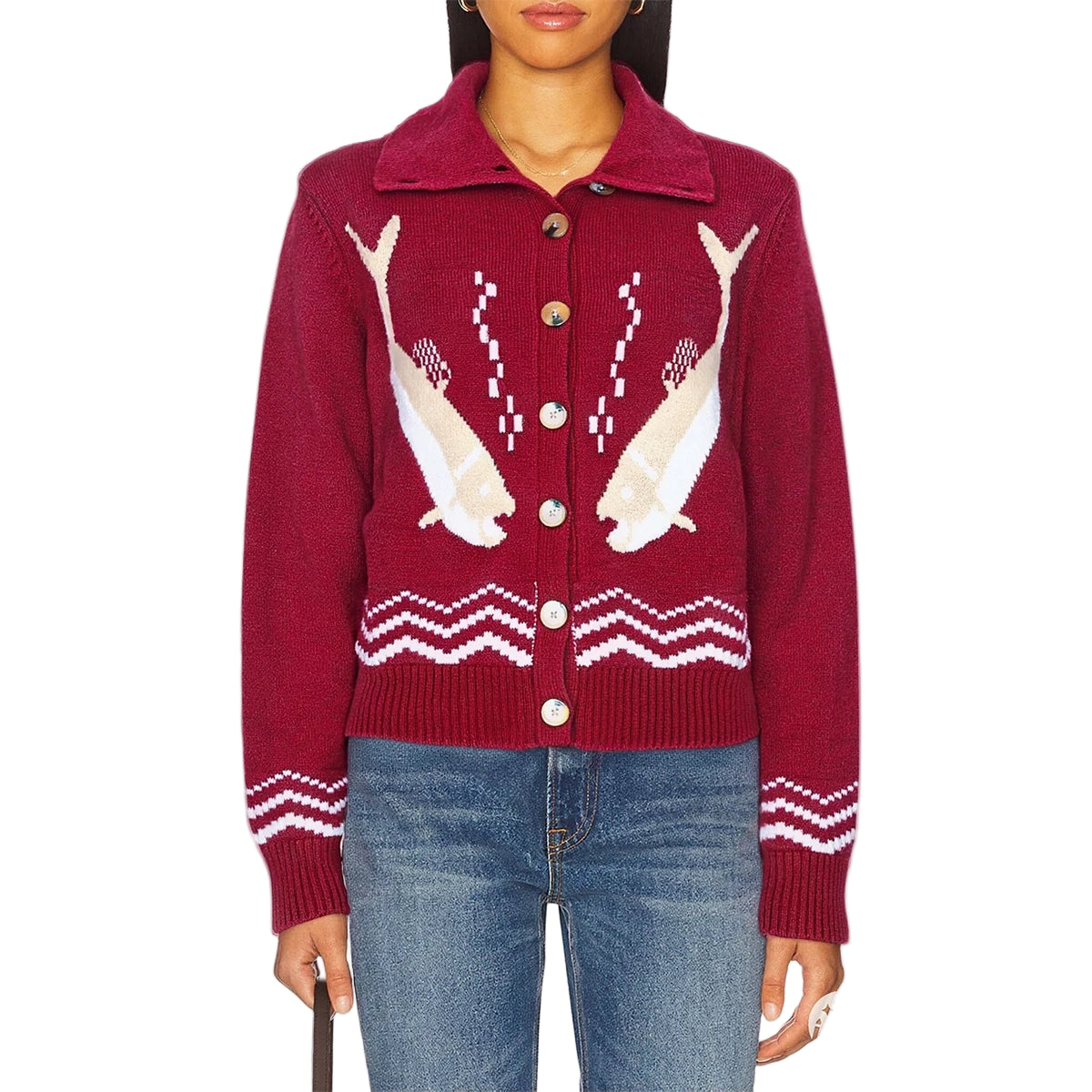 Red sweater with shark design worn by a person 