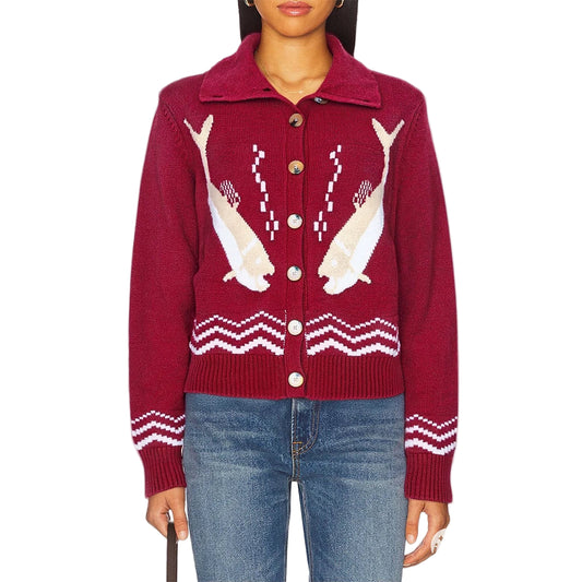 Red sweater with shark design worn by a person 