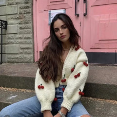 A woman wearing a 3D embroidered cardigan, highlighting how it adds a pop of personality to her outfit.