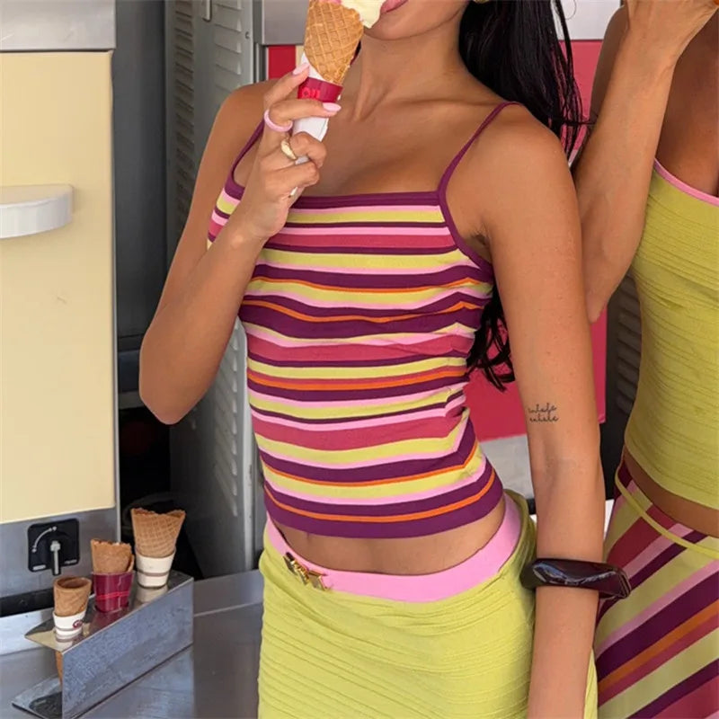 Fashionable young adult wearing a colorful striped spaghetti strap top.
