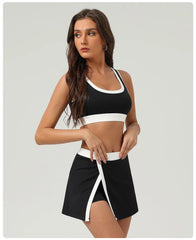 Woman wearing a black and white sports bra and skirt set- close-up