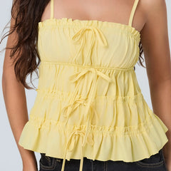 Yellow ruffled top worn by a person 
