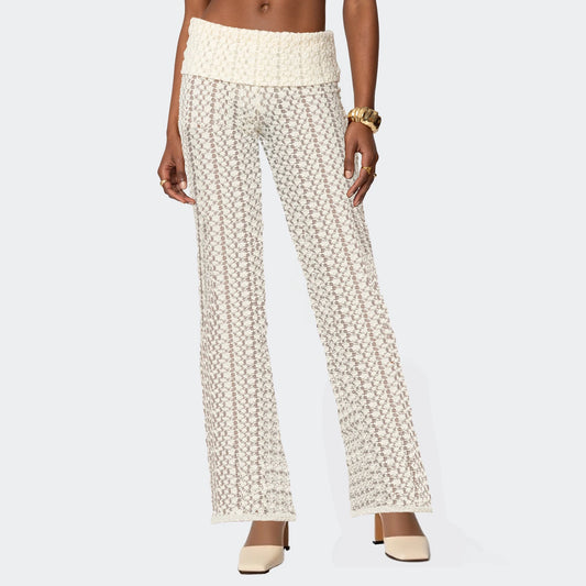 White patterned pants worn by a person on a white background