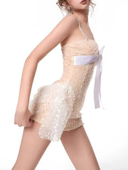 Model wearing a mini dress with a flattering A-line silhouette and sparkling strap details.