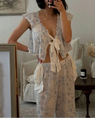 Person wearing a patterned outfit in a living room setting