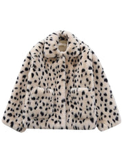 White coat with black dalmatian print on a white background