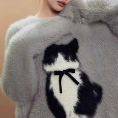  Fuzzy sweater with a cute cat design.