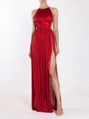 Women's red maxi dress with pleated details, halter neckline, and open back.