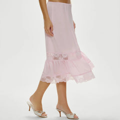 Pink lace skirt worn by a person 