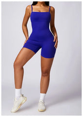 Person wearing a blue bodysuit on a plain background