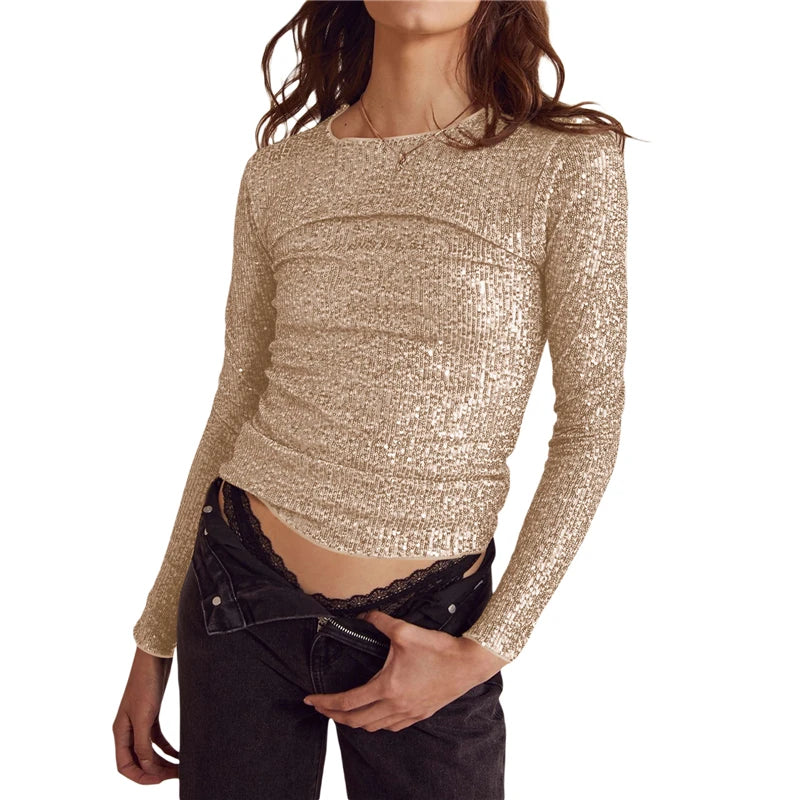 Woman wearing a sparkly gold long-sleeve top 