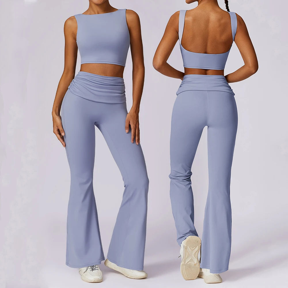 Person wearing a light blue athletic outfit with flared pants