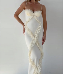 White ruffled dress on a plain background