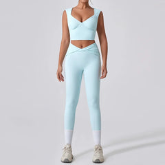 Person wearing a light blue athletic outfit on a plain background