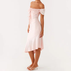 Woman wearing a light pink off-shoulder dress