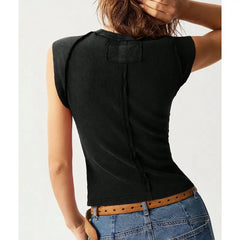 Model displaying a short round neck tank top with star appliques in a patchwork pattern.