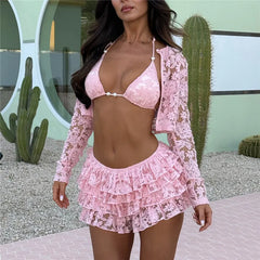 Woman wearing a pink lace outfit with cacti in the background