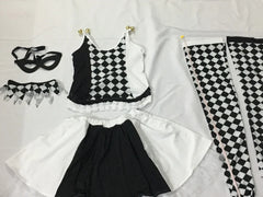 “Burlesque-inspired black and white jester costume”