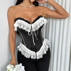 Black lace corset worn by a model against a white curtain background