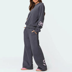Women's bow print hooded sweatshirt and matching tracksuit set.

