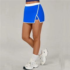 Person wearing a blue skirt and white sneakers 