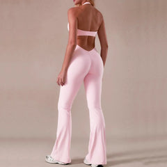 Person wearing a pink athletic outfit on a beige background