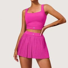 Person wearing a bright pink athletic outfit on a plain background