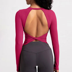 Pink long-sleeve top with open back and gray leggings-back design