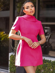 A pink short sleeve mini dress featuring an Uptown style collar, shown on model.