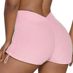 Pink shorts worn by a person - back