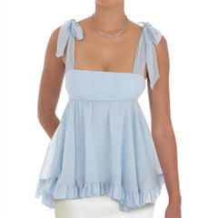 Light blue sleeveless top with bow straps worn by a model