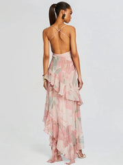 Woman wearing a pink floral dress with a white background