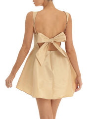 Beige dress with a bow detail in back