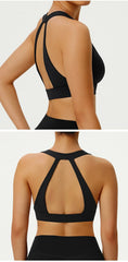 Black sports bra with open back design on a neutral background