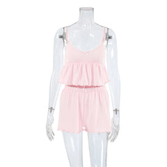 Pink romper on a mannequin against a white background