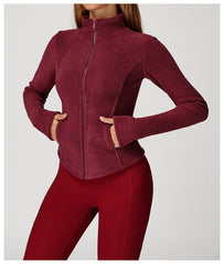 Maroon zip-up jacket worn by a person on a light gray background