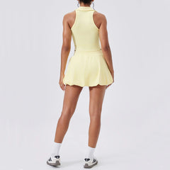 Person wearing a yellow tennis dress on a white background